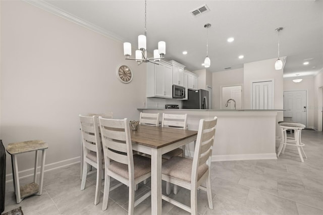 dining room with baseboards, an inviting chandelier, ornamental molding, recessed lighting, and visible vents