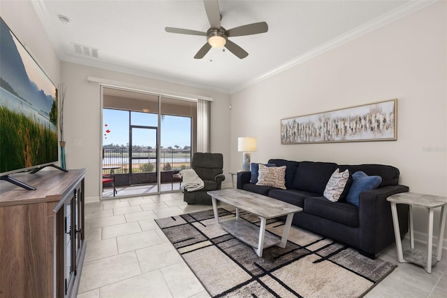 living room with crown molding, ceiling fan, light tile patterned floors, visible vents, and baseboards