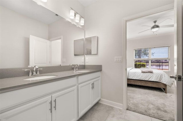 full bath with a sink, double vanity, ensuite bath, and a ceiling fan