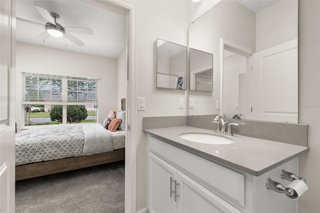 bathroom with vanity, ensuite bathroom, and ceiling fan