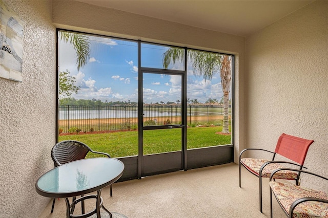 sunroom with a water view
