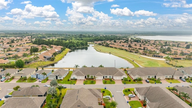 bird's eye view featuring a water view and a residential view