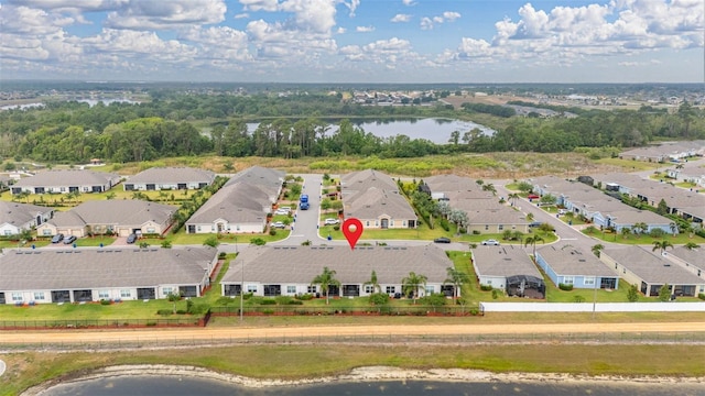 birds eye view of property with a residential view and a water view
