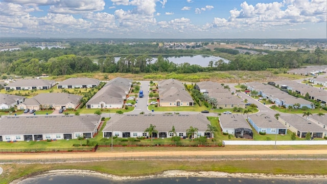 drone / aerial view featuring a residential view and a water view