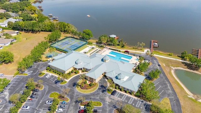 birds eye view of property with a water view