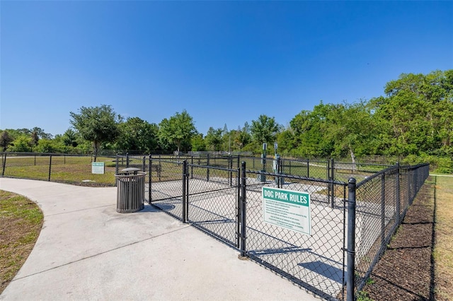 view of gate with fence