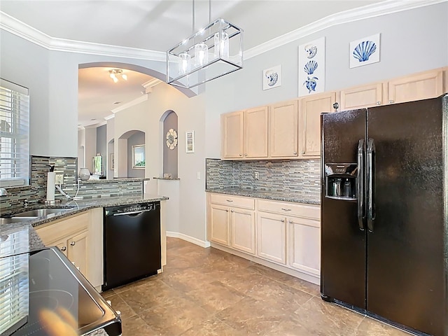 524 Grand Canal Dr, Poinciana, FL 34759 - kitchen with arched walkways, a sink, crown molding, black appliances, and backsplash