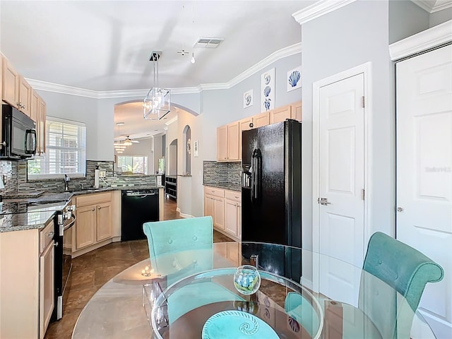 524 Grand Canal Dr, Poinciana, FL 34759 - kitchen with visible vents, black appliances, light brown cabinetry, and crown molding