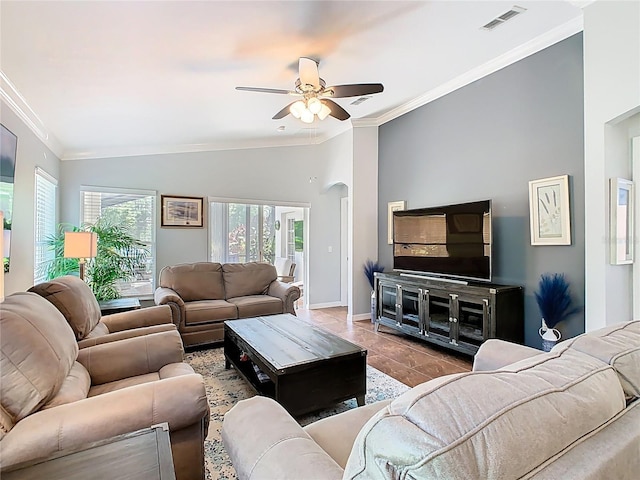524 Grand Canal Dr, Poinciana, FL 34759 - tiled living room with visible vents, arched walkways, ornamental molding, a ceiling fan, and vaulted ceiling