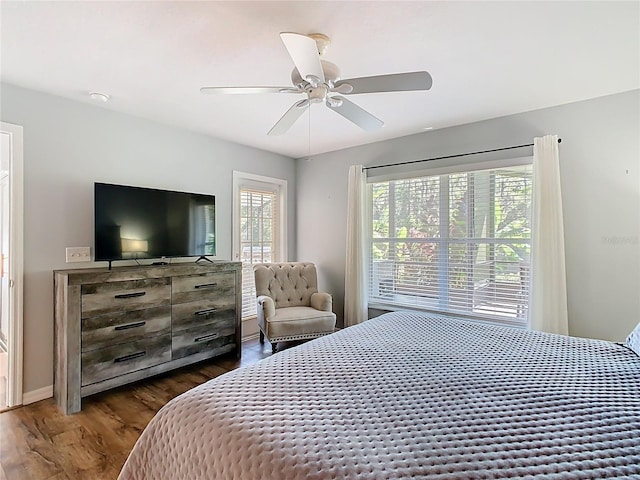 524 Grand Canal Dr, Poinciana, FL 34759 - bedroom featuring dark wood-style flooring and ceiling fan