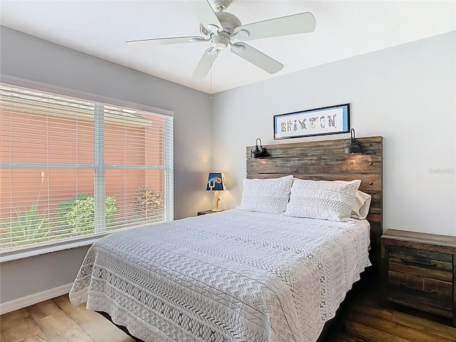 524 Grand Canal Dr, Poinciana, FL 34759 - bedroom with baseboards, a ceiling fan, and wood finished floors