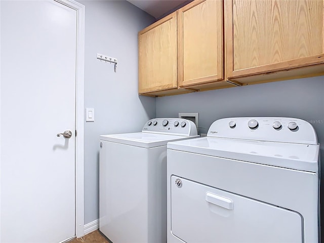 524 Grand Canal Dr, Poinciana, FL 34759 - clothes washing area with separate washer and dryer, baseboards, and cabinet space