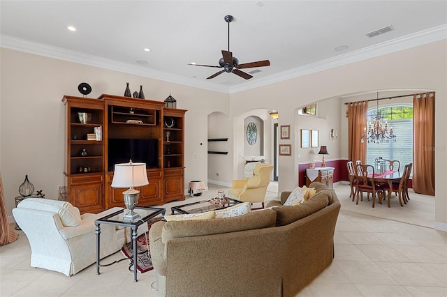 133 Torino Ln, Kissimmee, FL 34759 - living room featuring arched walkways, light tile patterned floors, crown molding, a ceiling fan, and a chandelier