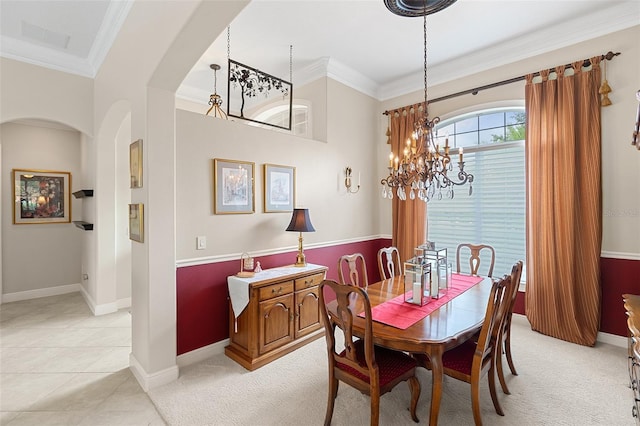 133 Torino Ln, Kissimmee, FL 34759 - dining room with a chandelier, arched walkways, crown molding, light colored carpet, and light tile patterned flooring