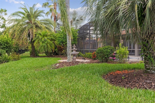 133 Torino Ln, Kissimmee, FL 34759 - view of yard featuring a lanai