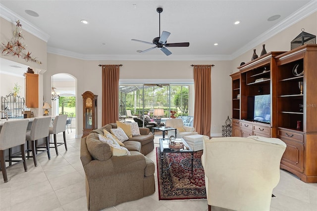 133 Torino Ln, Kissimmee, FL 34759 - living room with a ceiling fan, arched walkways, plenty of natural light, ornamental molding, and light tile patterned floors