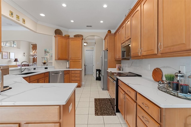 133 Torino Ln, Kissimmee, FL 34759 - kitchen with appliances with stainless steel finishes, arched walkways, light tile patterned flooring, ornamental molding, and light stone countertops