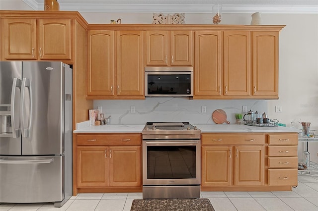 133 Torino Ln, Kissimmee, FL 34759 - kitchen featuring stainless steel appliances, light countertops, light tile patterned floors, and crown molding