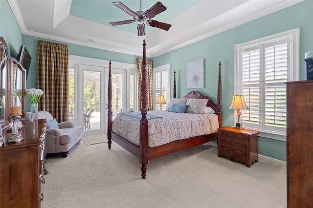 133 Torino Ln, Kissimmee, FL 34759 - carpeted bedroom with access to exterior, crown molding, a tray ceiling, and a ceiling fan