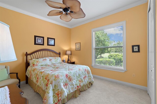 133 Torino Ln, Kissimmee, FL 34759 - carpeted bedroom featuring ornamental molding and a ceiling fan