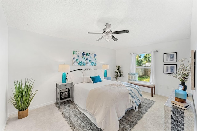 1560 Vista Lake Cir, Melbourne, FL 32904 - bedroom featuring light carpet, baseboards, a ceiling fan, and a textured ceiling