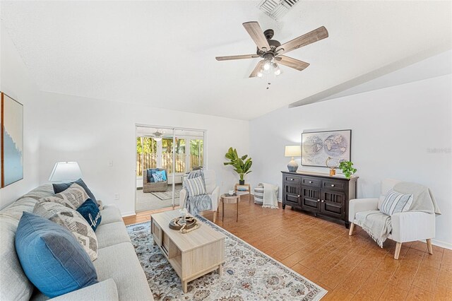 1560 Vista Lake Cir, Melbourne, FL 32904 - living room with light wood-style floors, lofted ceiling, a ceiling fan, and visible vents