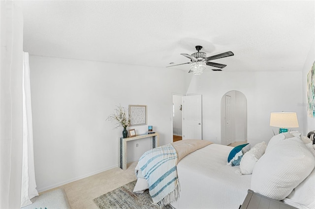 1560 Vista Lake Cir, Melbourne, FL 32904 - carpeted bedroom featuring baseboards, a ceiling fan, arched walkways, and a textured ceiling