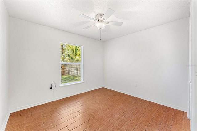 1560 Vista Lake Cir, Melbourne, FL 32904 - unfurnished room with baseboards, light wood-style floors, a textured ceiling, and a ceiling fan