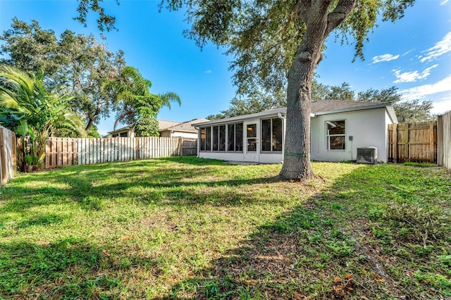 1560 Vista Lake Cir, Melbourne, FL 32904 - view of yard featuring central AC unit, a fenced backyard, and a sunroom