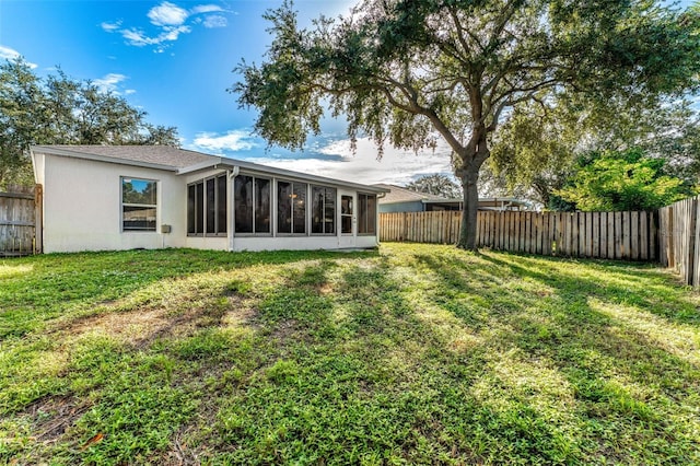 1560 Vista Lake Cir, Melbourne, FL 32904 - back of house featuring a fenced backyard and a lawn