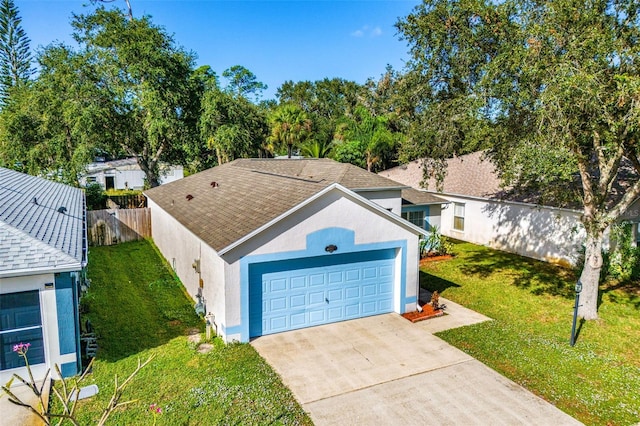 1560 Vista Lake Cir, Melbourne, FL 32904 - exterior space featuring stucco siding, fence, a front lawn, an attached garage, and driveway