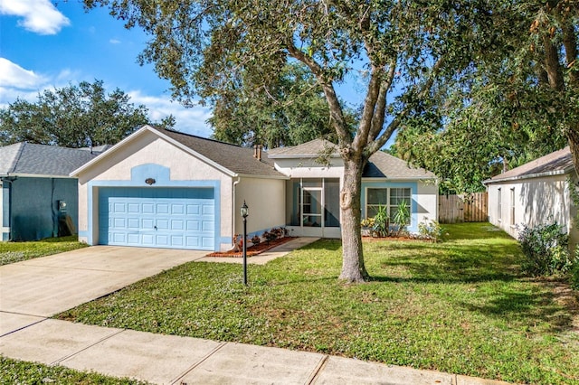 1560 Vista Lake Cir, Melbourne, FL 32904 - ranch-style house with stucco siding, driveway, an attached garage, a front lawn, and fence