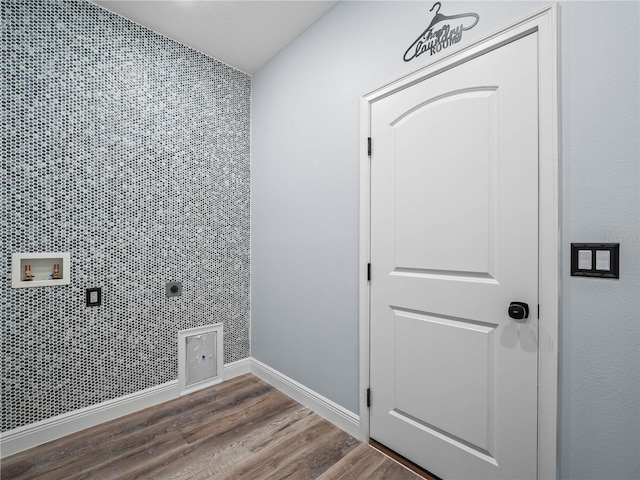 145 Willow Dr, Poinciana, FL 34759 - clothes washing area with laundry area, wood finished floors, washer hookup, hookup for an electric dryer, and baseboards