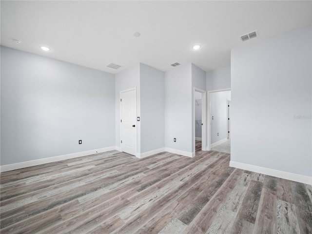 145 Willow Dr, Poinciana, FL 34759 - spare room with visible vents, baseboards, and wood finished floors