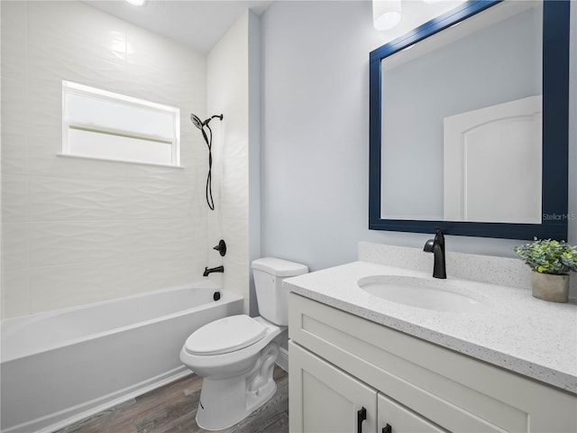 145 Willow Dr, Poinciana, FL 34759 - bathroom featuring bathing tub / shower combination, wood finished floors, vanity, and toilet