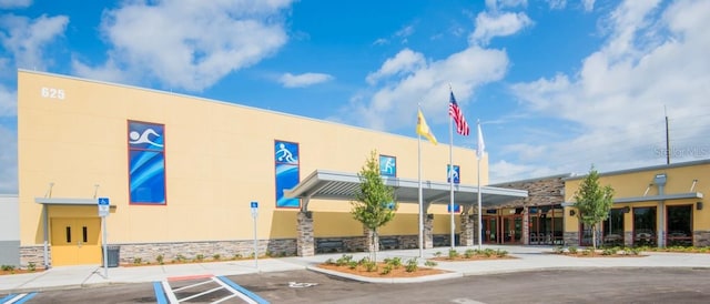 145 Willow Dr, Poinciana, FL 34759 - view of building exterior with uncovered parking