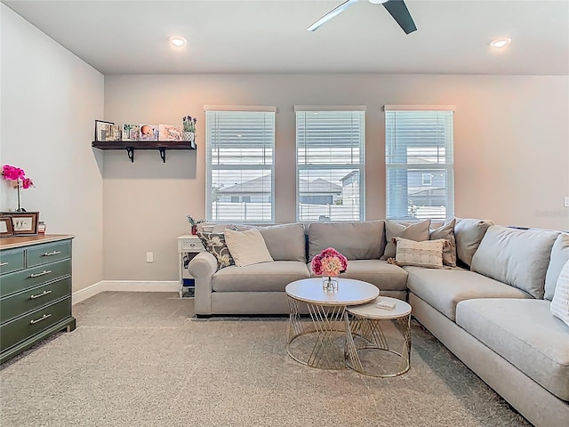 living area featuring baseboards, light colored carpet, recessed lighting, and ceiling fan