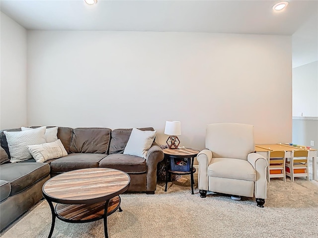 living room with light colored carpet and recessed lighting