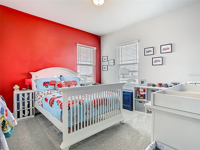 bedroom with light colored carpet
