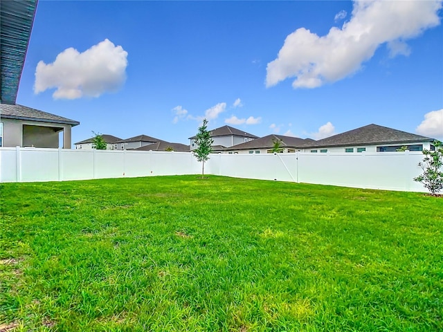 view of yard featuring a fenced backyard