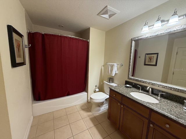 full bathroom with visible vents, toilet, a textured ceiling, vanity, and tile patterned flooring