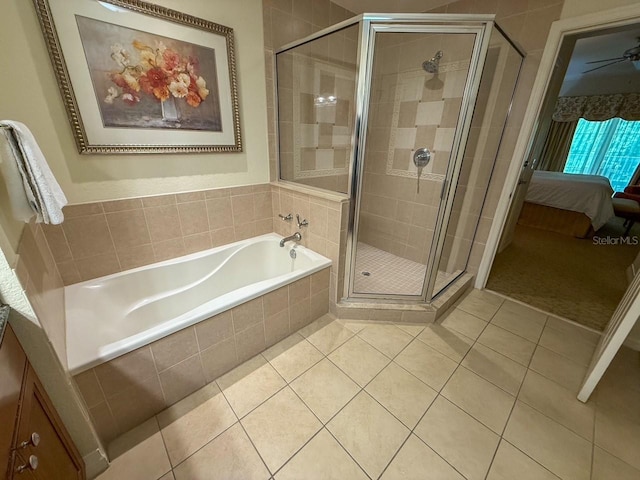 bathroom with tile patterned floors, connected bathroom, a stall shower, and a garden tub