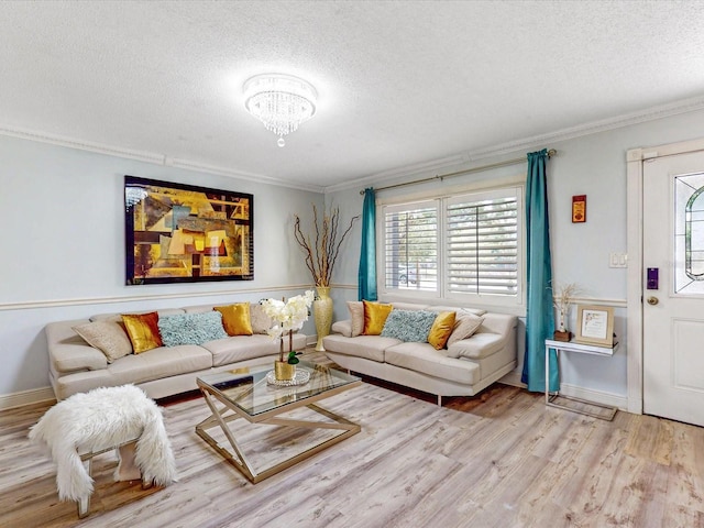 5123 Lighthouse Rd, Orlando, FL 32808 - living area featuring a textured ceiling, ornamental molding, wood finished floors, a chandelier, and baseboards