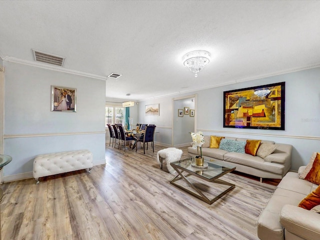 5123 Lighthouse Rd, Orlando, FL 32808 - living area featuring crown molding, wood finished floors, baseboards, and a textured ceiling