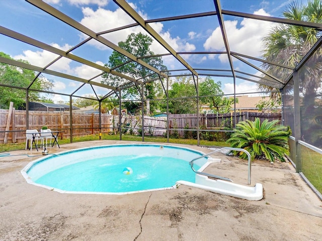 5123 Lighthouse Rd, Orlando, FL 32808 - view of pool with a fenced backyard, a patio area, and glass enclosure