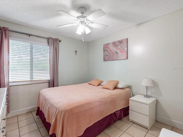 5123 Lighthouse Rd, Orlando, FL 32808 - bedroom featuring light tile patterned flooring, baseboards, a textured ceiling, and ceiling fan