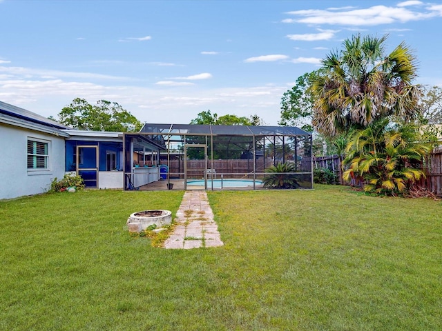 5123 Lighthouse Rd, Orlando, FL 32808 - view of yard featuring a fire pit and glass enclosure
