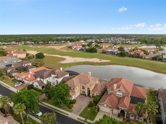aerial view featuring a residential view, view of golf course, and a water view