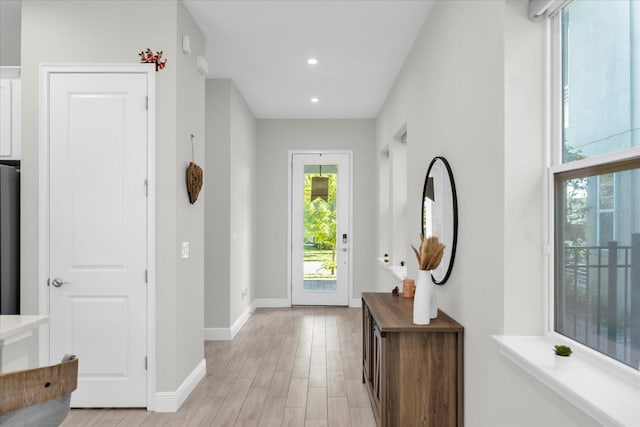 8338 Modiano St, Orlando, FL 32827 - entrance foyer featuring baseboards, recessed lighting, and light wood-type flooring