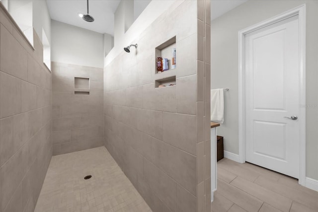 8338 Modiano St, Orlando, FL 32827 - full bath featuring baseboards and tiled shower